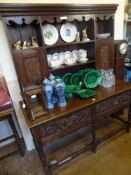 An Antique Oak Cottage Dresser, upper section with two cupboards to either side of three plate