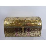 A Brass and Copper Domed Casket, the casket depicting floral spandrels, approx 26 x 15 x 13 cms.