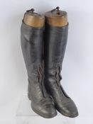 Two Pairs of Gentleman's Black Riding Boots, one pair fitted with wooden lasts, together with