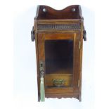 A Gentleman's Oak Smokers Cabinet, glazed fronted with single internal drawer and pipe rack, brass