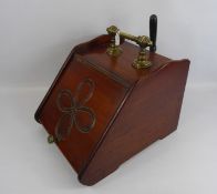 An Edwardian Mahogany and Brass Coal Scuttle, fitted with a ebony handled coal shovel, together with
