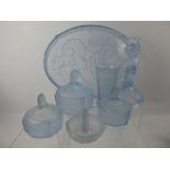 A Light Blue Glass Dressing Table Set, comprising candle sticks, two small trinket dishes, cotton