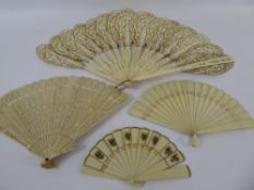 Two 19th Century Miniature Ivorine Fans, the first with decorative piercing to the top of the sticks