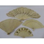 Two 19th Century Miniature Ivorine Fans, the first with decorative piercing to the top of the sticks