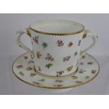 A Meissen Chocolate Pot and Saucer, hand painted with floral spray, twin twisted handles, blue