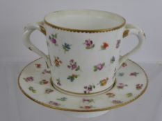 A Meissen Chocolate Pot and Saucer, hand painted with floral spray, twin twisted handles, blue