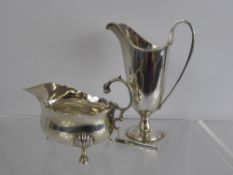 A Solid Silver Helmet-Shaped Cream Jug, Sheffield hallmark dated 1961, mm EV, together with a
