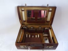 Gentleman's Brown Leather Toiletry Case, fitted interior with accessories.