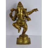 An Indian Gilt Metal Hindu Figure of Ganesh, depicted dancing, approx 16 cms