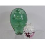A Victorian Green Glass Dump Weight, approx 15 cms with nine floral inclusions together with a