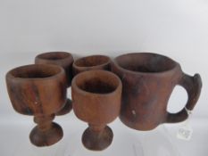 Five Hand Carved Wood Goblets and Jug of Aboriginal origin.