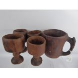 Five Hand Carved Wood Goblets and Jug of Aboriginal origin.