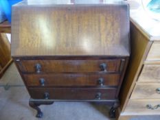 A Vintage Oak Drop-Front Bureau, fitted interior, having three graduated drawers on ball and claw