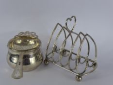 A Silver Tea Strainer and Stand, Birmingham hallmark dd 1933, mm Suckling Ltd., together with a