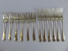 A Set of Six Silver Dinner Forks, London hallmark dated 1937, together with a set of six small forks