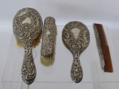 A Lady's Silver Dressing Table Set, including hairbrush, mirror, clothes brush and comb. (af),