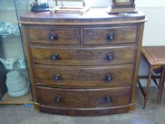 An Antique Mahogany Chest of Drawers, two short and three long graduated drawers, raised on turned