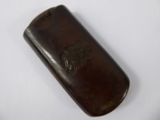 A Gentleman's Vintage Leather Cigar Case, with striker, the case having an embossed heraldic crest