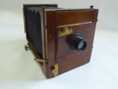 A 19th Century 'The Champion' Box Camera, with a small quantity of accessories including two lenses,