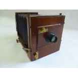 A 19th Century 'The Champion' Box Camera, with a small quantity of accessories including two lenses,