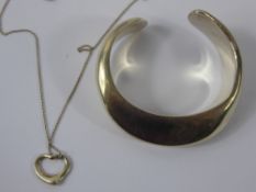 A Tiffany Silver Bangle, together with a Tiffany heart necklace, approx 43 gms