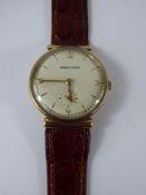 A Gentleman's Vintage 9 ct Jaeger le Coultre Wrist Watch, having a white face (27 mm)