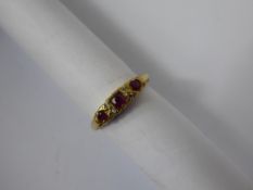 A Lady's Antique 18 ct Yellow Gold Ruby & Diamond Ring, the ring set with three rubies and four