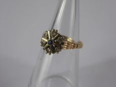 A Lady's 9 ct Yellow Gold Diamond and Sapphire Star Ring, size T, approx 3.5 gms.