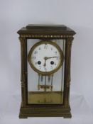 A French Gilt Brass Four-Glass Mantel Clock, eight-day movement with mercurial pendulum, white