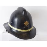 A Vintage Leading-Fireman's Helmet, Gloucestershire Fire Service.