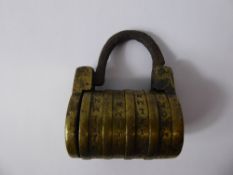 An Antique Brass Disk Numerical Pad Lock.