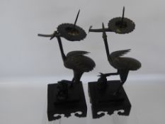 A Pair of Chinese Bronzed Candlesticks, in the form of cranes, approx 28 cms.