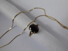 A Lady's 9ct Gold Necklace, approx 1.3 gms, together with a 9 ct gold Garnet ring