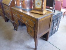 A Mid 20th Century Oak Desk, two short and two long drawers, approx 99 x 45.5 x 76 cms.