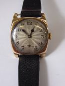 A Gentleman's 9 ct Gold Vintage Rolex Wrist Watch. The watch having an engine turned face with