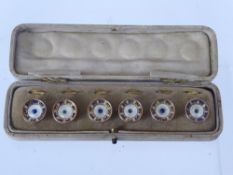 A Set of Gentleman's Silver Gilt and Mother of Pearl Dress Studs, in the original box. (af)