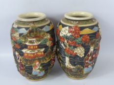 A Pair of Japanese Satsuma Vases, with "raised" figures in a garden with pagodas, approx 21 cms