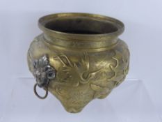 An Antique Brass Censer, the censer having raised dragons chasing a pearl and with applied white