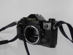 Canon A1 (no Canon mirror squeak, tested). Power winder A (untested).