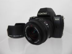 Contax NX Camera, 28-80 Vario Sonnar Lens (nof - tested), together with instruction book.
