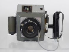 Mamiya 23 Camera, + 6 x 6,6 x 4.5 Rollfilm back, 90/3.5 lens (nof).