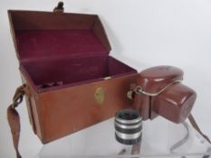 A Leather Corfield Camera Case, Ever-Ready Case and 50/35 Lumax lens.