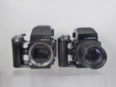 2 x Zenza Bronica ETRS cameras, 2 x 120 Backs, 2 x Metered Prisms (winders not cocking shutters,