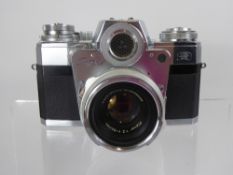 Contarex Camera + 50/2 Planar Lens (dent to top of prism).