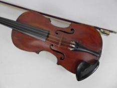 An Antique English Hand-Made Violin, with bow and accessories in a fitted case.