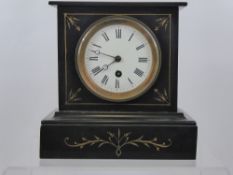 A Victorian Slate Mantel Clock, with a white face and Roman numerals.