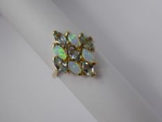 A Lady's 9ct Yellow Gold blue Topaz and Opal Ring, topaz 5 x 2.6 mm, size O, approx 3.3 gms.