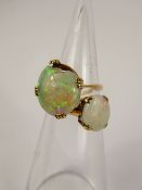 Two Lady's 9ct Yellow Gold Opal Ring, one 10 x 8 mm size P and the other 14 x 12 mm (damaged) size