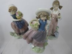 Three Lladro Figurines, depicting children with flowers, approx 18 cms each