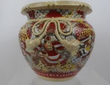 A Japanese Satsuma Jardiniere, the jardiniere having warriors to side with character marks to